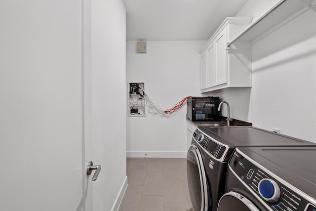 2104 Zaide Way, Celina, TX 75009 - washroom featuring independent washer and dryer, cabinet space, and baseboards