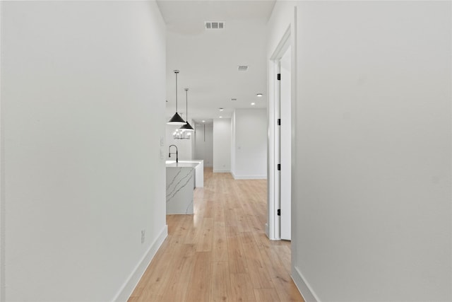 1218 Gannon Ln, Desoto, TX 75115 - hallway featuring baseboards, light wood-style flooring, and recessed lighting