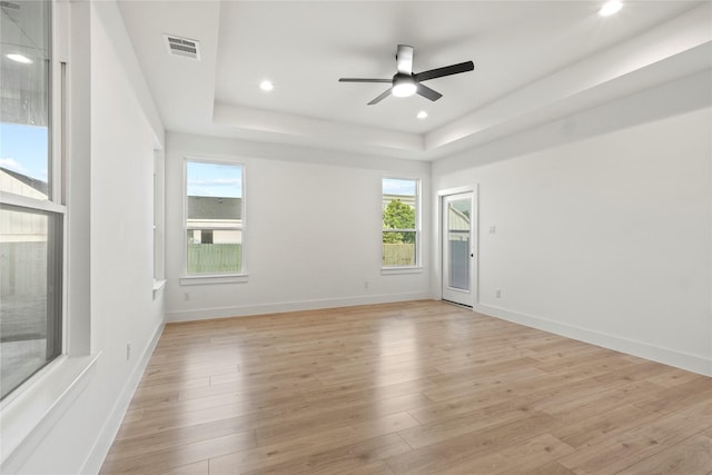 1218 Gannon Ln, Desoto, TX 75115 - empty room featuring a ceiling fan, a raised ceiling, light wood-style flooring, recessed lighting, and baseboards