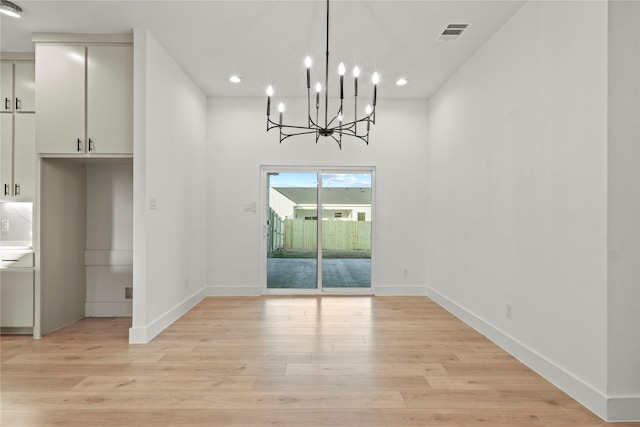 1218 Gannon Ln, Desoto, TX 75115 - unfurnished dining area with a chandelier, light wood finished floors, recessed lighting, and baseboards