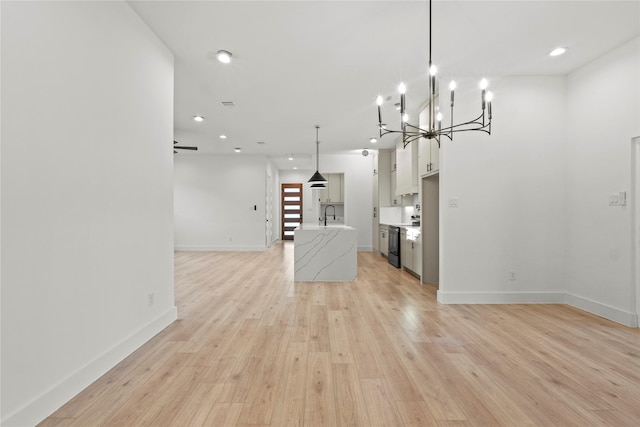 1218 Gannon Ln, Desoto, TX 75115 - unfurnished living room with light wood-style floors, baseboards, a chandelier, a sink, and recessed lighting