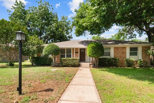 207 Mcmurry Ave, Duncanville, TX 75116 - view of front of house with a front yard and brick siding