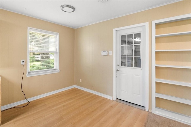 207 Mcmurry Ave, Duncanville, TX 75116 - empty room with light wood-type flooring and ornamental molding