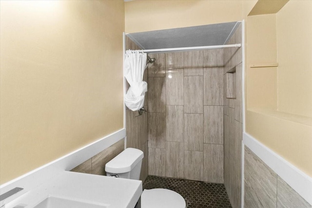 207 Mcmurry Ave, Duncanville, TX 75116 - bathroom featuring tiled shower and vanity