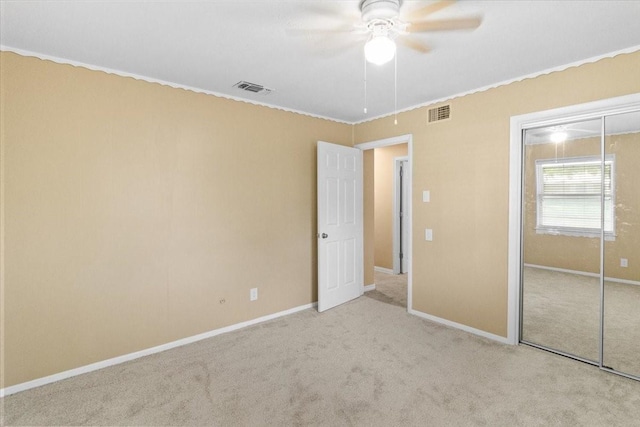 207 Mcmurry Ave, Duncanville, TX 75116 - unfurnished bedroom with a closet, carpet floors, ornamental molding, and ceiling fan