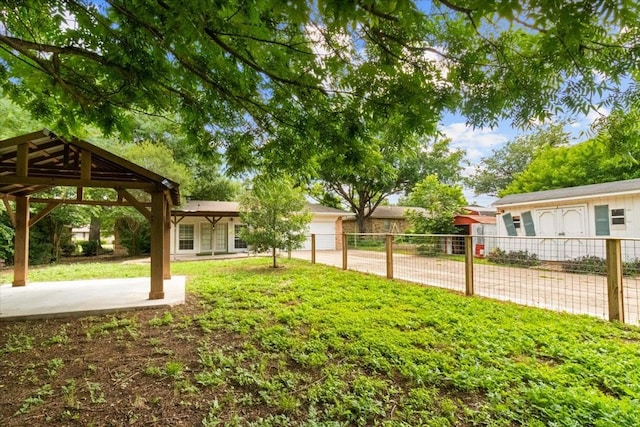207 Mcmurry Ave, Duncanville, TX 75116 - view of yard with an attached garage, driveway, and a gazebo