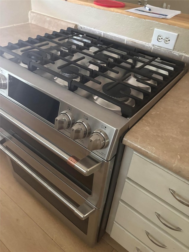207 Mcmurry Ave, Duncanville, TX 75116 - kitchen view of stainless steel gas range oven and light countertops