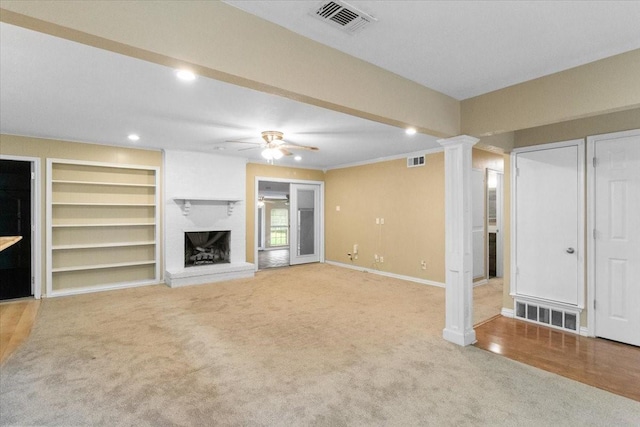 207 Mcmurry Ave, Duncanville, TX 75116 - unfurnished living room featuring ornate columns, a ceiling fan, carpet, a brick fireplace, and recessed lighting