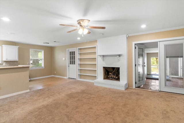 207 Mcmurry Ave, Duncanville, TX 75116 - unfurnished living room with light carpet, ceiling fan, a fireplace, recessed lighting, and ornamental molding