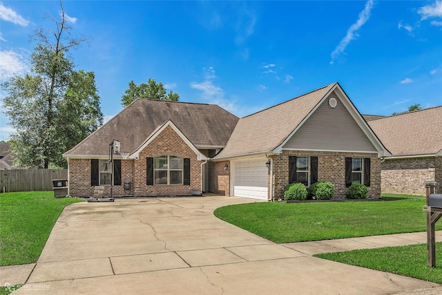 181 Bent Tree Loop, Haughton, LA 71037 - view of front of house featuring an attached garage, brick siding, concrete driveway, and roof with shingles