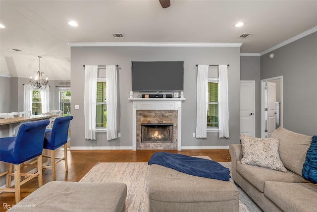181 Bent Tree Loop, Haughton, LA 71037 - living room featuring a chandelier, wood finished floors, a fireplace, crown molding, and baseboards