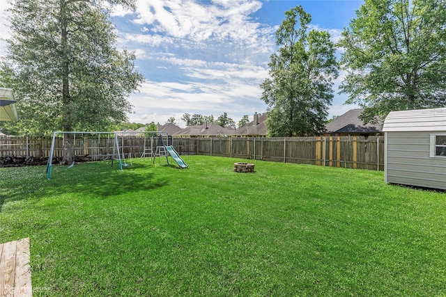 181 Bent Tree Loop, Haughton, LA 71037 - view of yard with a playground and an outdoor fire pit