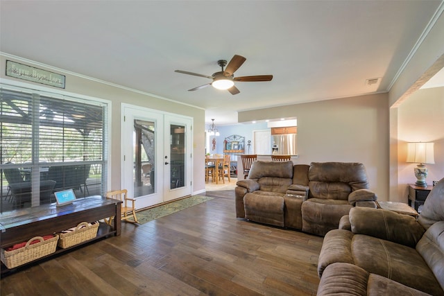 6710 Eastview Dr, Sachse, TX 75048 - living area with ornamental molding, a ceiling fan, wood finished floors, and a chandelier