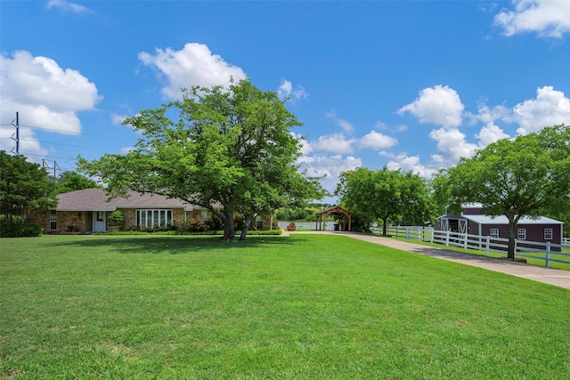 6710 Eastview Dr, Sachse, TX 75048 - view of yard featuring a carport, driveway, and a gazebo