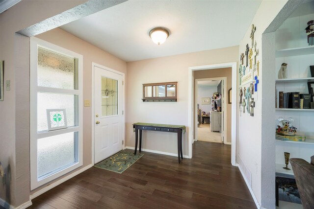 6710 Eastview Dr, Sachse, TX 75048 - foyer with dark wood finished floors, healthy amount of natural light, and baseboards