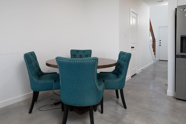 18747 Fm 2493, Flint, TX 75762 - dining room with finished concrete floors, baseboards, and stairway