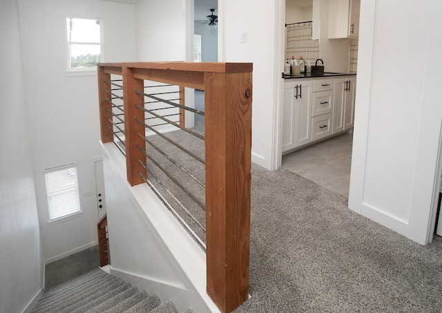 18747 Fm 2493, Flint, TX 75762 - stairway with carpet flooring, a ceiling fan, and baseboards