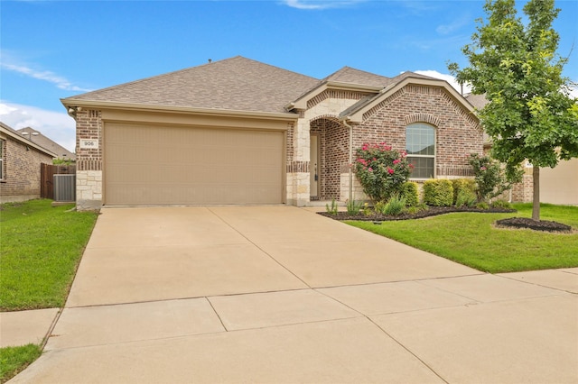 906 Silverbell St, Princeton, TX 75407 - view of front facade featuring brick siding, an attached garage, a front lawn, and driveway