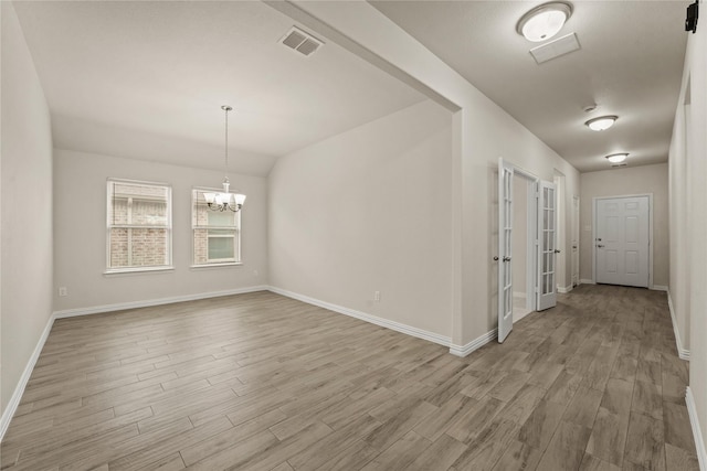 906 Silverbell St, Princeton, TX 75407 - spare room featuring light wood-style floors and a chandelier