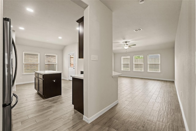 906 Silverbell St, Princeton, TX 75407 - kitchen featuring freestanding refrigerator, light wood-style flooring, light countertops, ceiling fan, and recessed lighting