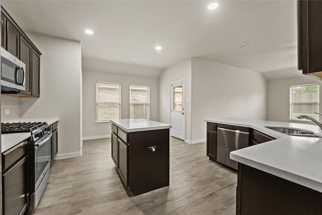 906 Silverbell St, Princeton, TX 75407 - kitchen featuring stainless steel appliances, a kitchen island, light wood-style floors, light countertops, and recessed lighting
