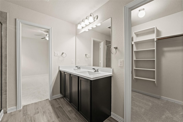906 Silverbell St, Princeton, TX 75407 - full bath with wood finished floors, ceiling fan, double vanity, and a shower with shower door