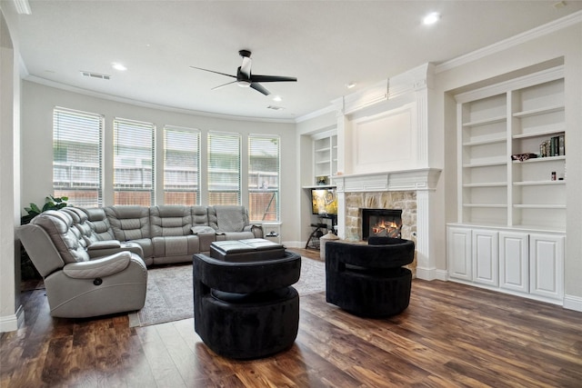 5833 Crescent Ln, Colleyville, TX 76034 - living area featuring a ceiling fan, ornamental molding, dark wood finished floors, built in features, and a fireplace