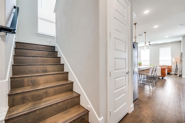 8977 George Cayley Ln, Frisco, TX 75034 - staircase with hardwood / wood-style flooring, recessed lighting, and baseboards