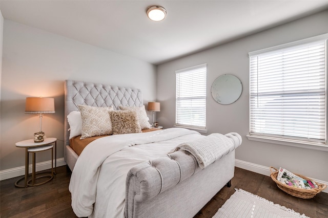 8977 George Cayley Ln, Frisco, TX 75034 - bedroom featuring baseboards and dark wood-style floors