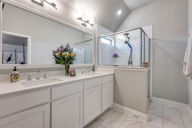 8977 George Cayley Ln, Frisco, TX 75034 - full bathroom featuring a shower stall, double vanity, marble finish flooring, and vaulted ceiling