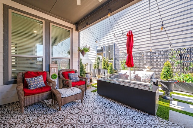8977 George Cayley Ln, Frisco, TX 75034 - view of patio with an outdoor living space with a fire pit