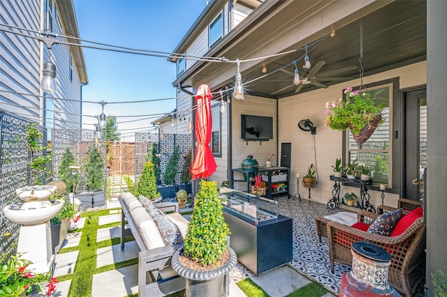 8977 George Cayley Ln, Frisco, TX 75034 - view of patio / terrace with an outdoor living space and ceiling fan