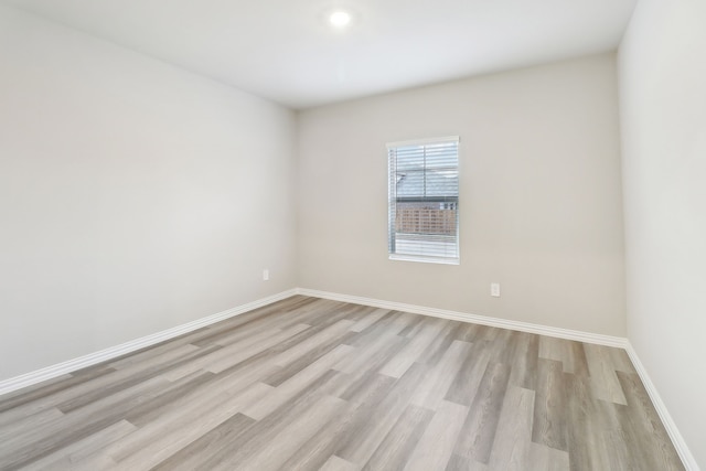 901 Lily Ln, Lavon, TX 75166 - empty room with light wood finished floors and baseboards