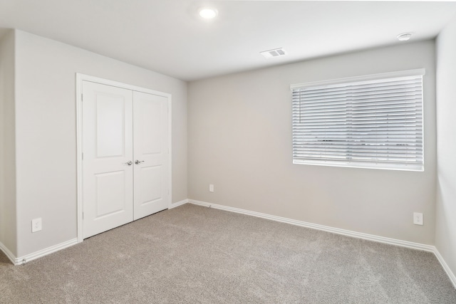 901 Lily Ln, Lavon, TX 75166 - unfurnished bedroom featuring carpet, baseboards, and a closet