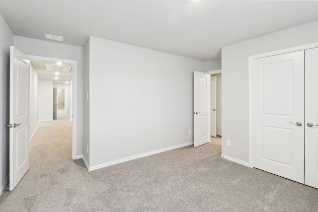 901 Lily Ln, Lavon, TX 75166 - unfurnished bedroom with light carpet, baseboards, and a closet