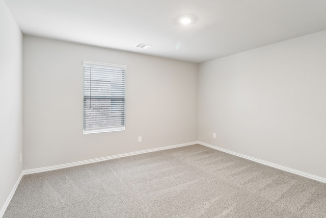 901 Lily Ln, Lavon, TX 75166 - spare room featuring carpet floors and baseboards