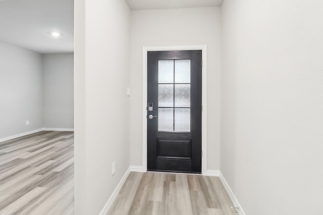 901 Lily Ln, Lavon, TX 75166 - doorway featuring wood finished floors and baseboards