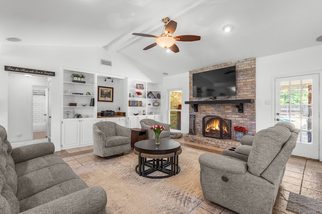 3213 Kingsbridge Dr, Plano, TX 75075 - living area with ceiling fan, a brick fireplace, built in features, and light tile patterned flooring