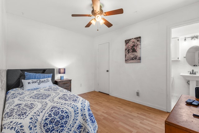 3213 Kingsbridge Dr, Plano, TX 75075 - bedroom with light wood finished floors, baseboards, connected bathroom, and a ceiling fan