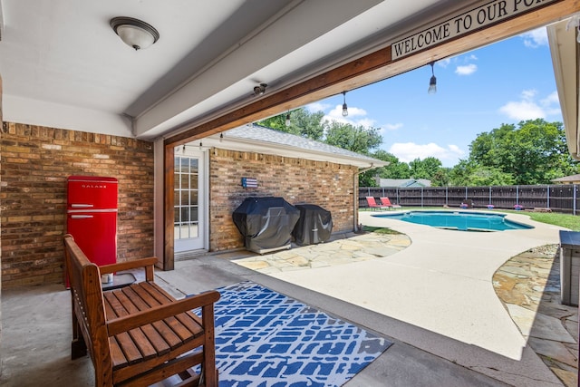 3213 Kingsbridge Dr, Plano, TX 75075 - fenced backyard with a patio and a grill
