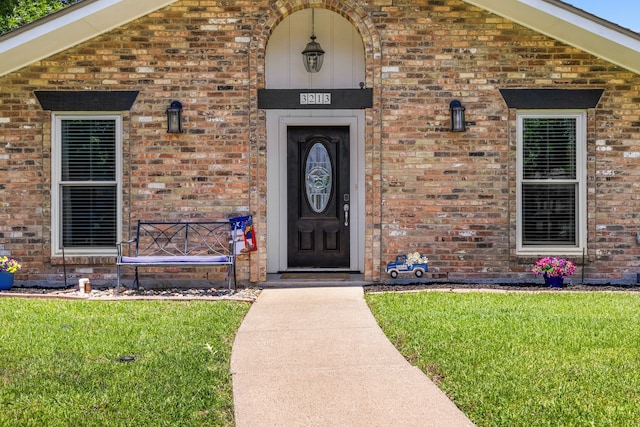 3213 Kingsbridge Dr, Plano, TX 75075 - property entrance with brick siding and a lawn