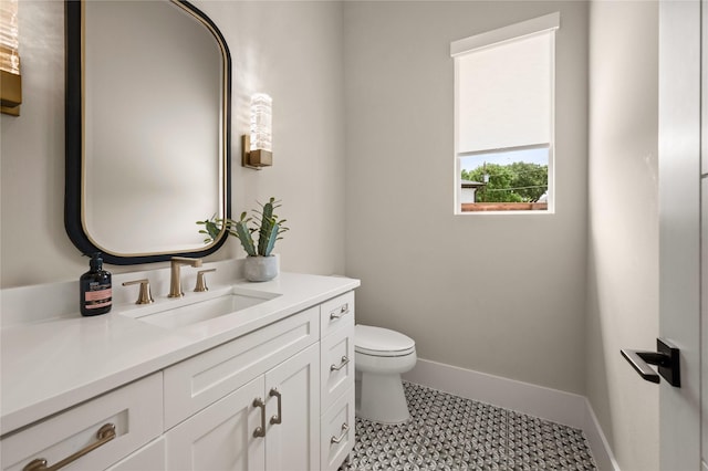 3313 Jackson Ct, Grapevine, TX 76092 - bathroom featuring toilet, vanity, and baseboards