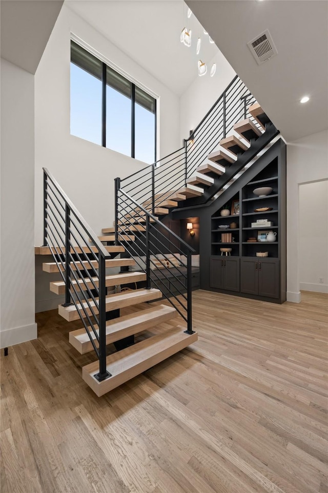 3313 Jackson Ct, Grapevine, TX 76092 - staircase featuring baseboards, wood finished floors, recessed lighting, and built in features