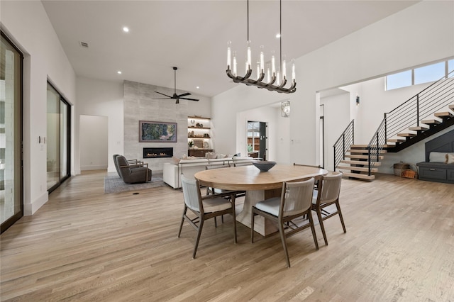 3313 Jackson Ct, Grapevine, TX 76092 - dining area featuring stairway, light wood finished floors, plenty of natural light, a high ceiling, and recessed lighting