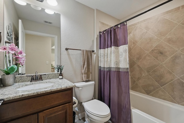 8829 Cantina Bay Ln, Frisco, TX 75036 - bathroom featuring a textured wall, vanity, shower / tub combo, and toilet