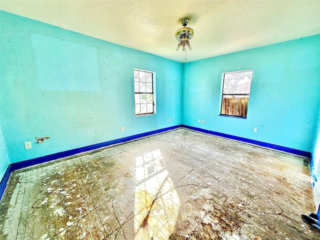2641 Old Anson Rd, Abilene, TX 79603 - unfurnished room featuring baseboards and a textured ceiling