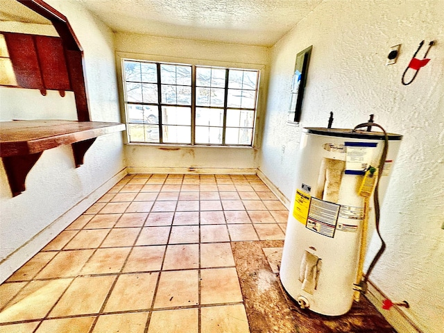 2641 Old Anson Rd, Abilene, TX 79603 - unfurnished dining area with water heater, a textured wall, and a textured ceiling