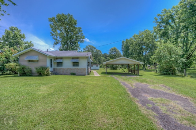 5123 Albany Rd, Shreveport, LA 71107 - view of front of house featuring a carport, a front lawn, driveway, and stone siding