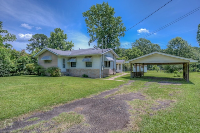 5123 Albany Rd, Shreveport, LA 71107 - view of front of property with a front yard, stone siding, a carport, and driveway