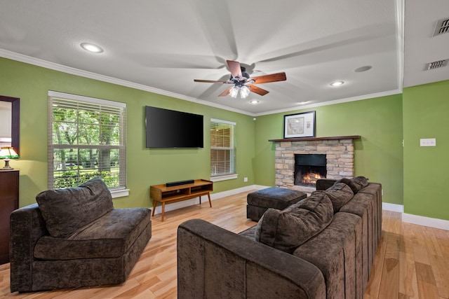 1432 Cimarron Trl, Hurst, TX 76053 - living area with ornamental molding, a ceiling fan, light wood-style floors, recessed lighting, and a fireplace